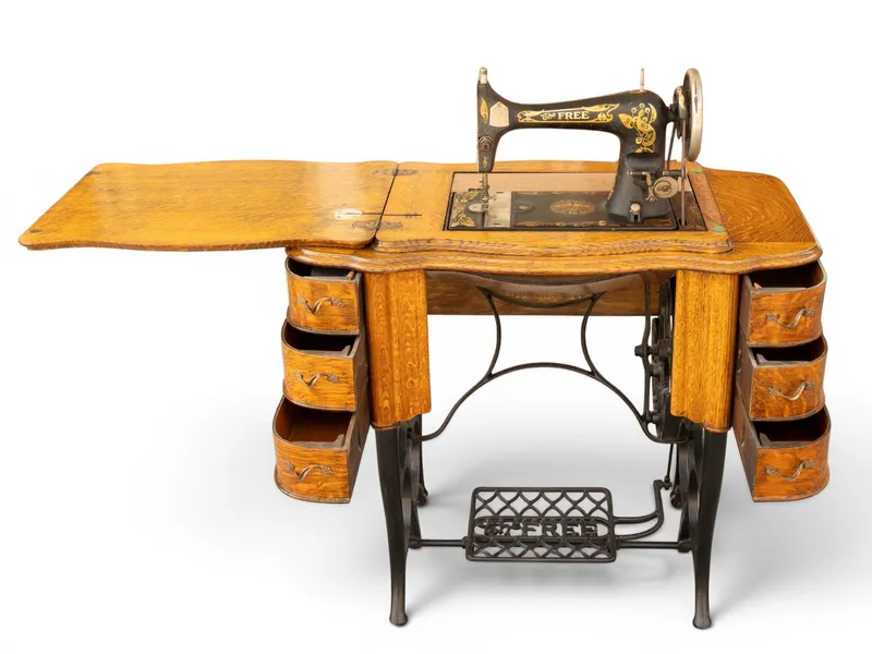 Oak Treadle Sewing Cabinet on Cast Iron Base from auction in York, Pennsylvania