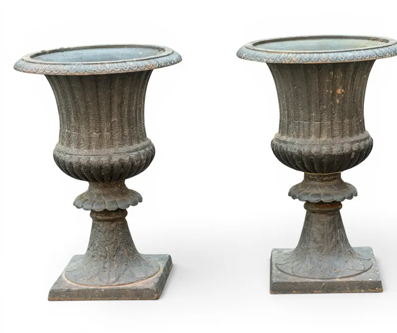 Pair of Cast Iron Garden Urns from auction in York, Pennsylvania