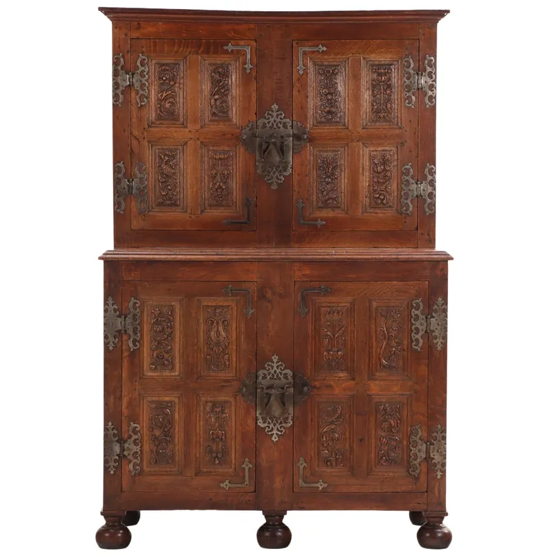 TWO PART OAK CABINET HAVING ELABORATE STEEL HARDWARE AND CARVED PANELS INSIDE AND OUT. MOST from auction in Philadelphia, Pennsylvania