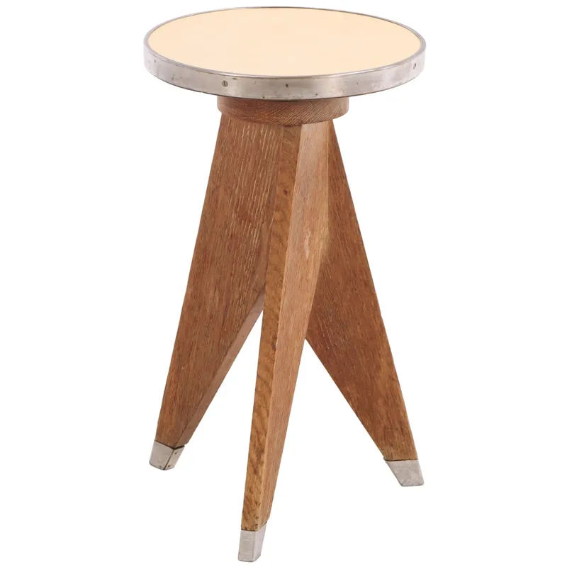 FRENCH OAK STOOL IN THE MANNER OF JEAN PROUVE C 1950 HAVING METAL TRIMMED LAMINATE TOP AND METAL from auction in Philadelphia, Pennsylvania