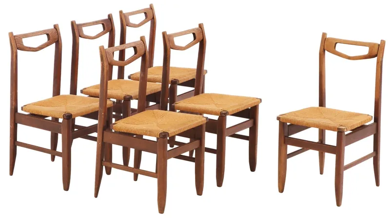 SIX FRENCH OAK AND RUSH DINING CHAIRS BY GUILLERME AND CHAMBRON C 1960. from auction in Philadelphia, Pennsylvania