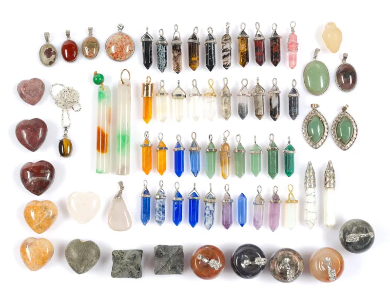 Carved Chinese Stone Pendants Including Double Terminated Crystals from auction in Harrisburg, Pennsylvania