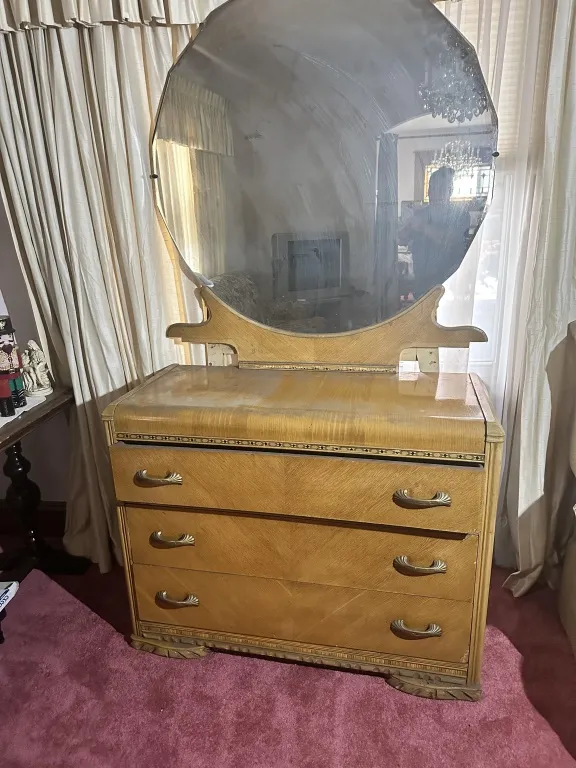Vintage Waterfall Dresser With Mirror 3-drawer dresser with large round mirror and decorative trim from auction in Clifford , Pennsylvania
