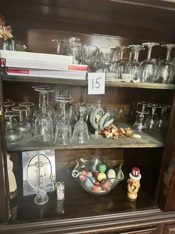 Hutch Contents With Glassware & Decor assorted glassware, stemware, teacups, holiday decor, ornaments, bells, and small decorative items from hutch from auction in Clifford , Pennsylvania