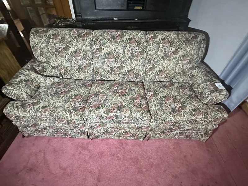 Floral Upholstered Sofa 3-cushion floral upholstered sofa. Measures approx. 85" long from auction in Clifford , Pennsylvania