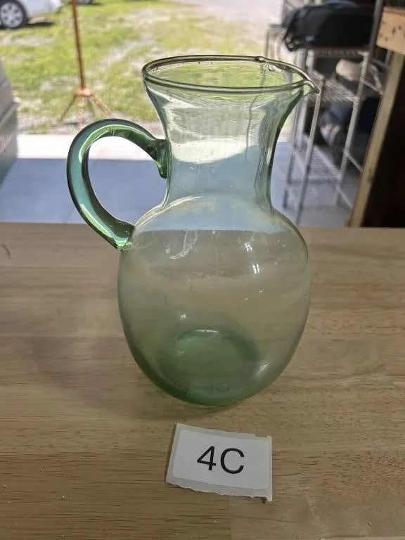 Green Handblown Glass Pitcher from auction in Clifford , Pennsylvania