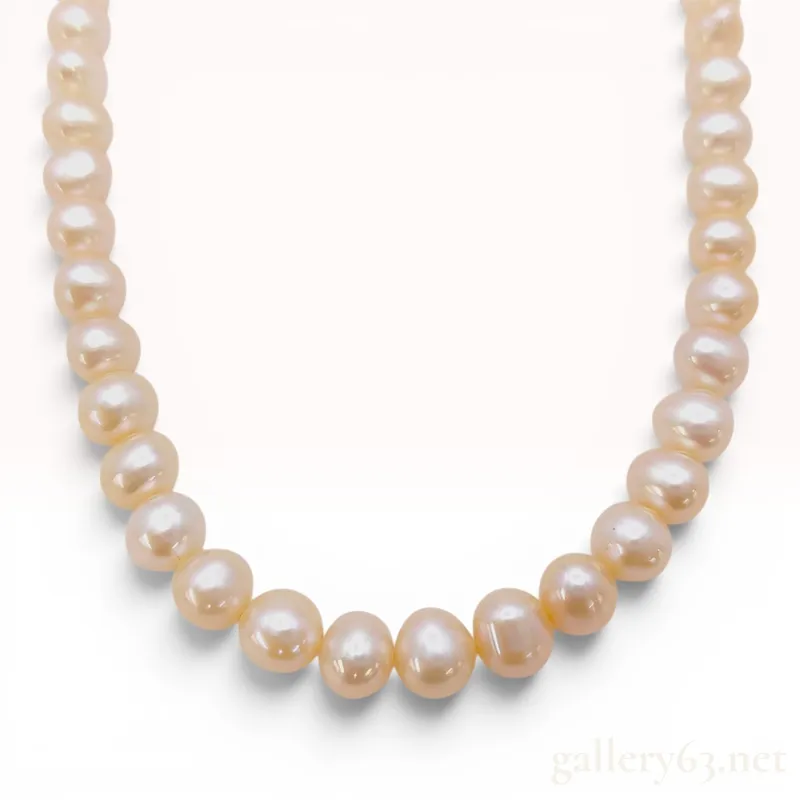 Semi-Round Pink Freshwater Cultured Pearl Necklace with Silver Clasp from auction in Atlanta, Georgia