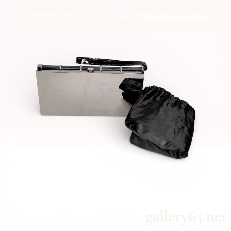 Yves Saint Laurent Mirror-Finish Hard Case Evening Clutch, Silver and Black Patent Leather from auction in Atlanta, Georgia