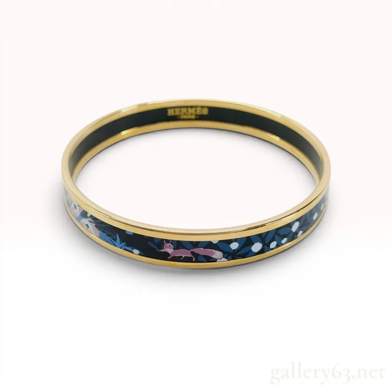 Hermes Gold Plated Enamel Bangle Bracelet in Dans Un Jardin Anglais Pattern from auction in Atlanta, Georgia