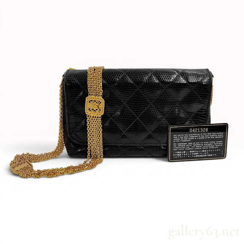An Important Chanel Vintage Black Quilted Lizard Skin Flap Bag with Multi-Strand Gold-Plated Chain, 0 Series 1984-1986 from auction in Atlanta, Georgia