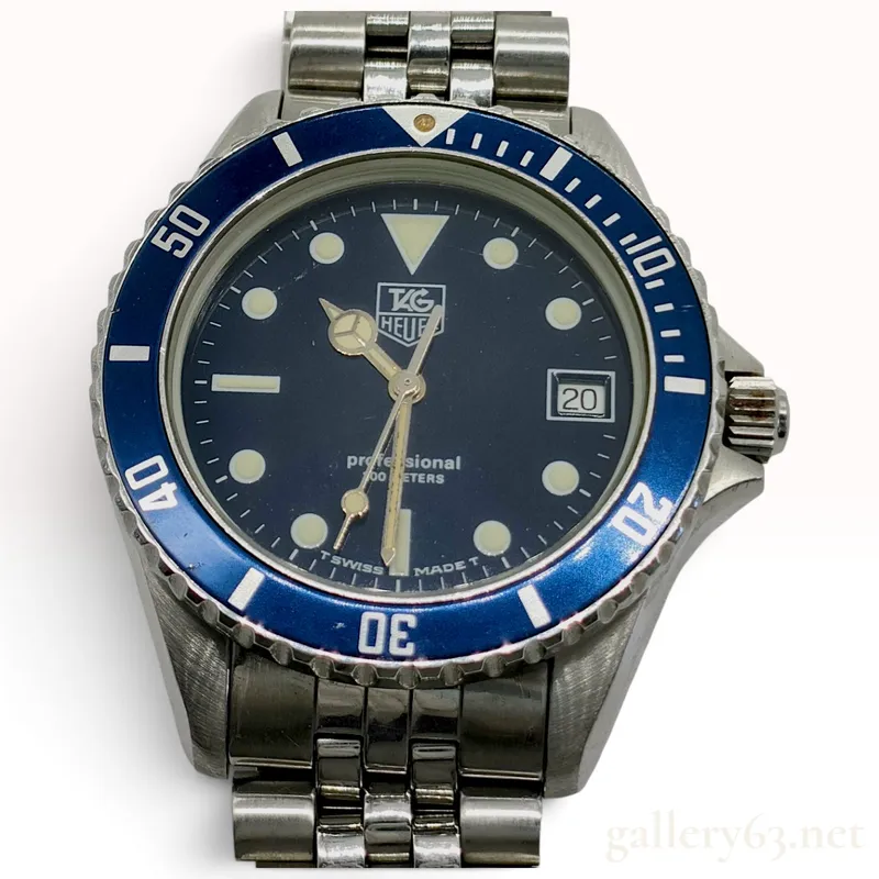 Vintage TAG Heuer Professional 1000 Series Blue Dial Stainless Steel Wristwatch from auction in Atlanta, Georgia