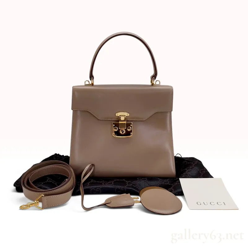Vintage Gucci Taupe Smooth Leather Top Handle Bag with Dust Bag and Mirror from auction in Atlanta, Georgia