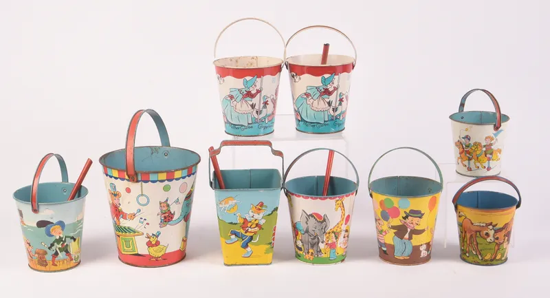 Nine Vintage Metal Children's Beach Pails. from auction in Freeport, Maine