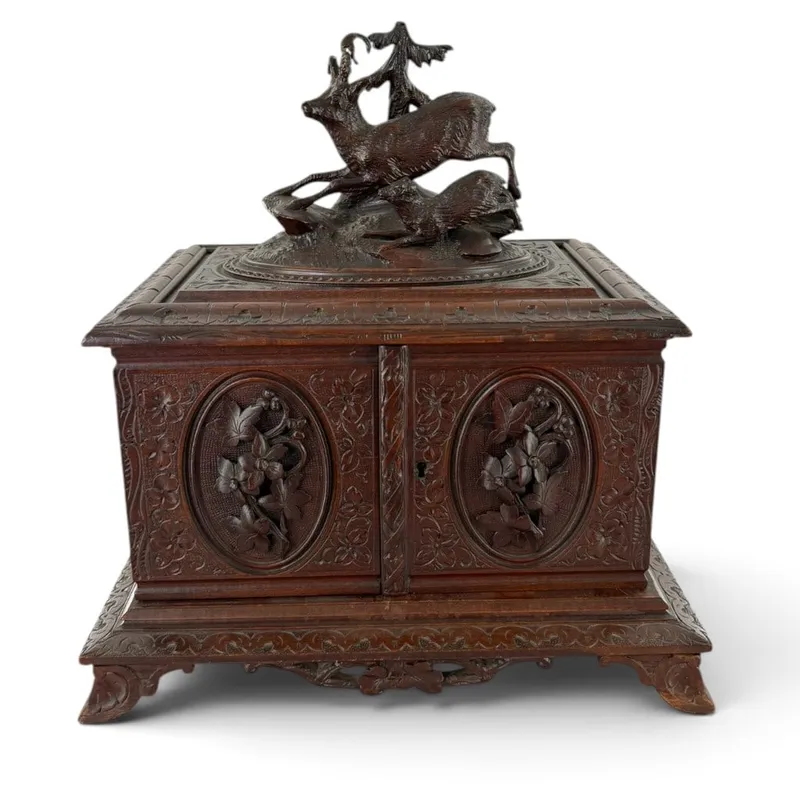 Swiss Black Forest Carved Deer Cigar Cabinet from auction in Aberdeen, Mississippi