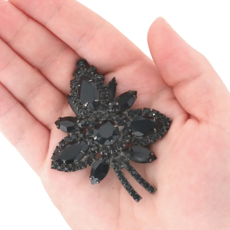 Juliana D&E Darkened Silver Tone Black Rhinestone Three Petal Cluster Brooch from auction in Ravenna, Ohio