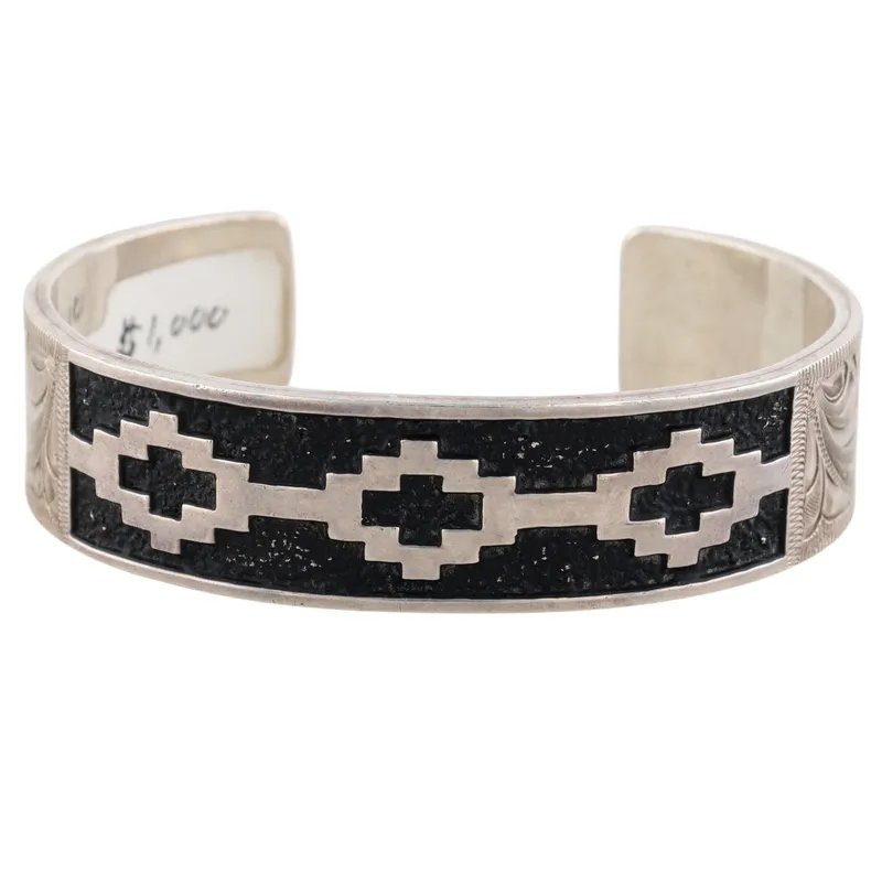 Julius Keyonnie Navajo Sterling Etched Overlay Cuff Bracelet from auction in Ravenna, Ohio