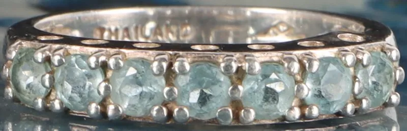 STERLING SILVER LADIES RING W/ SEVEN TOPAZ GEMS from auction in Tallahassee, Florida