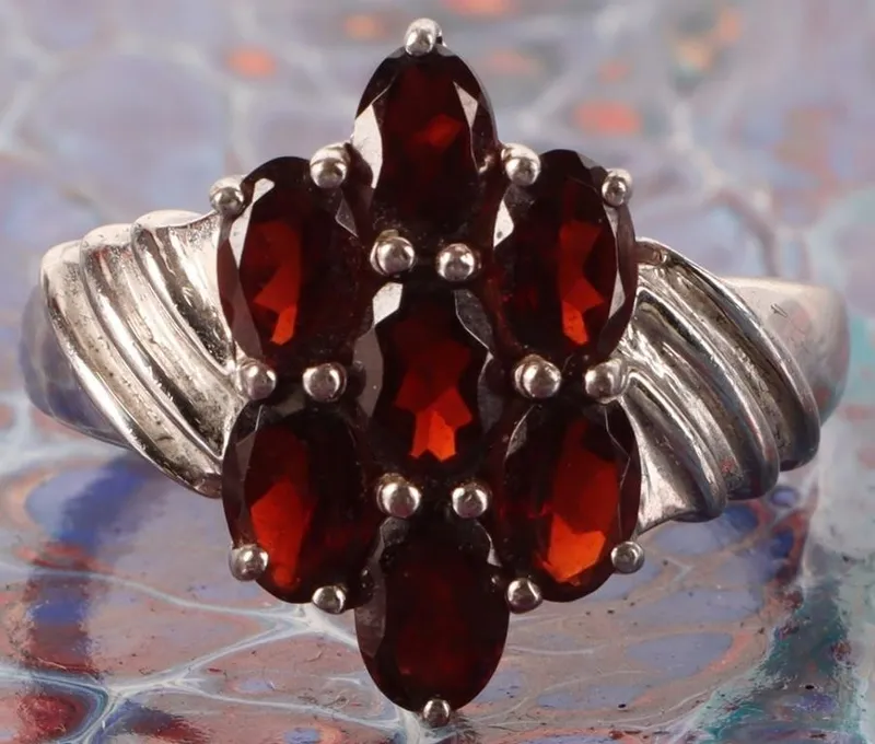 STERLING SILVER OVAL GARNET LADIES RING from auction in Tallahassee, Florida