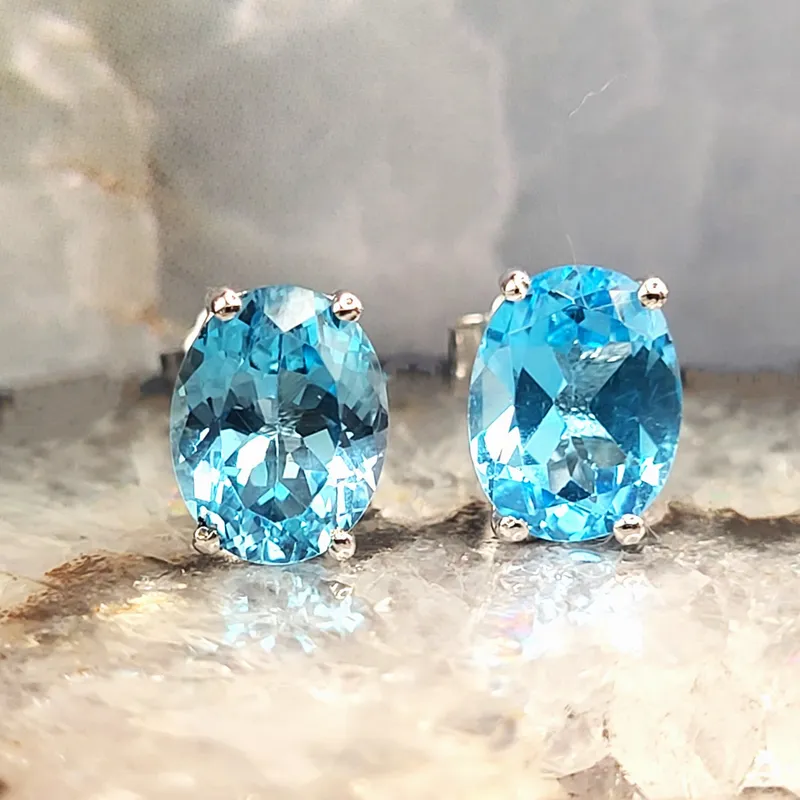 Swiss Blue Topaz Contemporary Solitaire Earrings from auction in Vero Beach, Florida