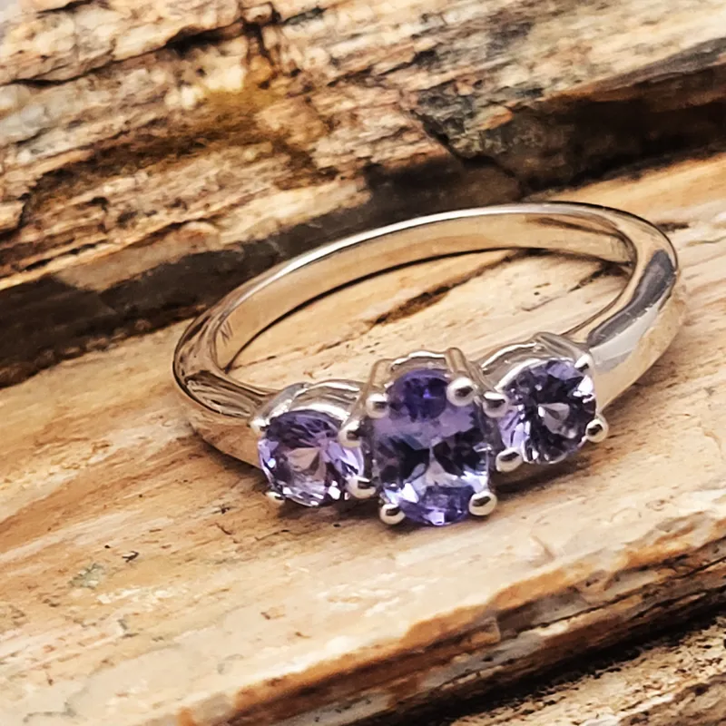 Genuine Tanzanite Mixed-Cut Three-Stone Ring .925 from auction in Vero Beach, Florida