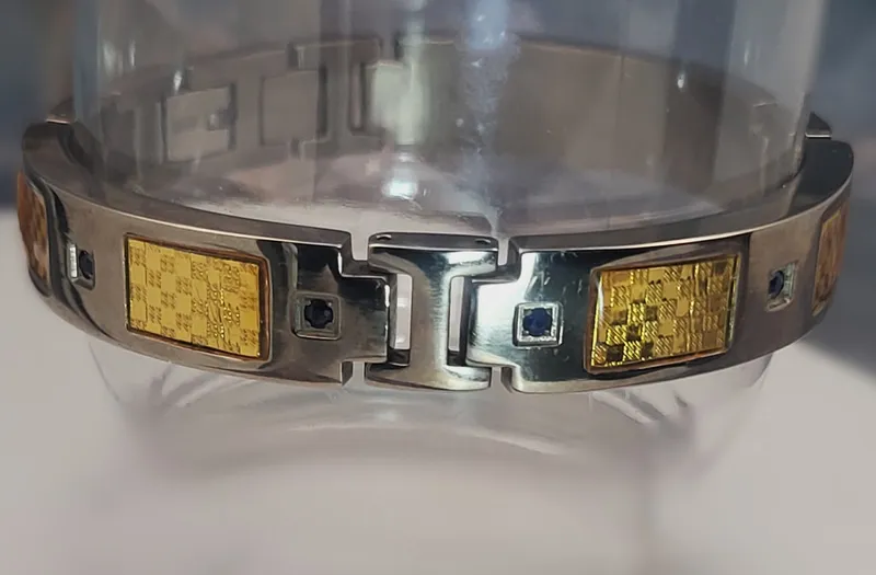 Titanium & YG Plated Steel Blue Sapphire Bracelet from auction in Vero Beach, Florida