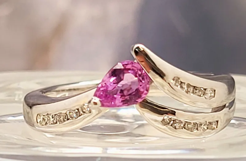 Pink Sapphire and Diamond Chevron Contour Ring from auction in Vero Beach, Florida