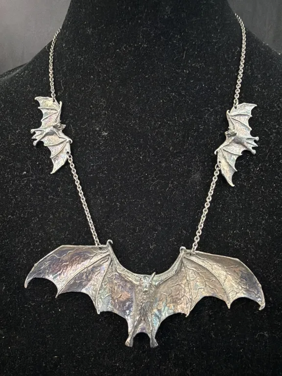 Sterling 3 Bat Necklace from auction in Orange Cit y, Florida