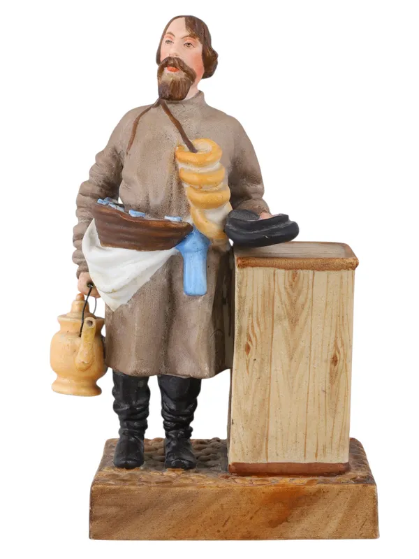 A RUSSIAN KUZNETSOV/GARDNER PORCELAIN FIGURE OF A SBITEN VENDOR, 19TH CENTURY from auction in New York, New York
