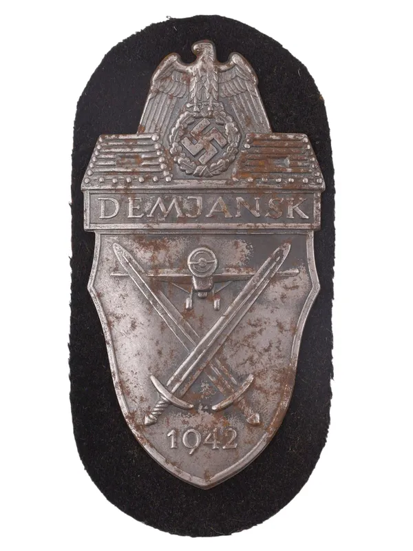 A GERMAN DEMJANSK CAMPAIGN SHIELD, WORLD WAR II from auction in New York, New York