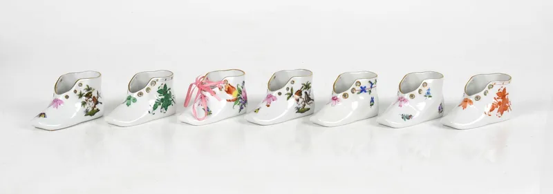 Seven Herend Hand-Painted Porcelain Baby Shoes, Late 20th Century from auction in Pineville, Pennsylvania