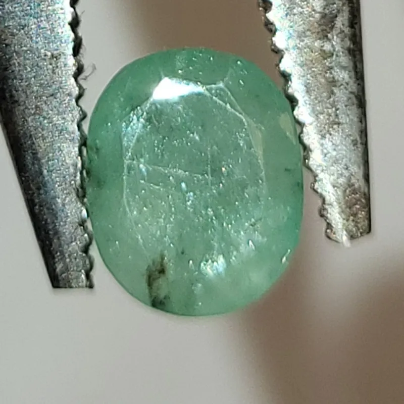 natural light green zambran ? emerald 2 carats from auction in wilmington , North Carolina