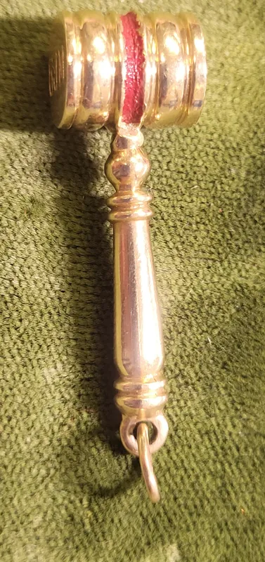 14K yellow gold gavel charm judge auctioneer from auction in wilmington , North Carolina
