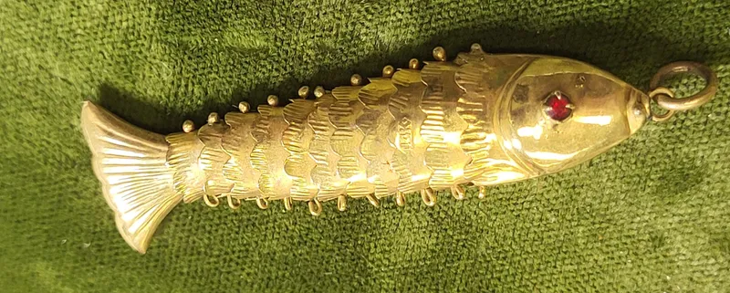 14K solid gold articulated fish pendant ruby eyes from auction in wilmington , North Carolina