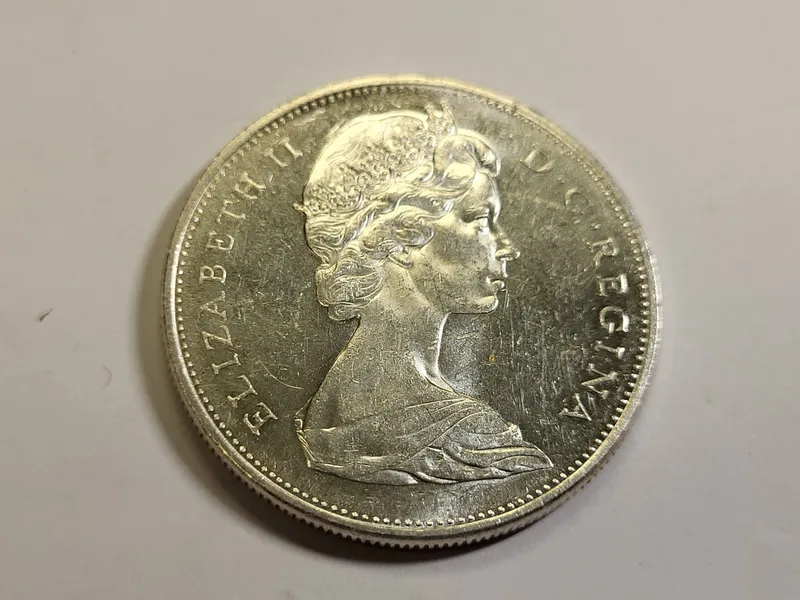 1965 canada silver dollar coin au-bu! error ? from auction in wilmington , North Carolina