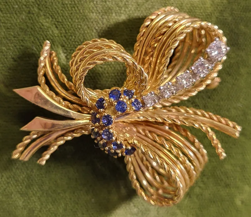 18K yellow gold diamonds & sapphire bow brooch from auction in wilmington , North Carolina