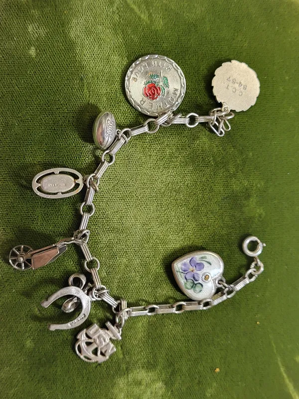 1950's sterling charm bracelet USN & football ++ from auction in wilmington , North Carolina