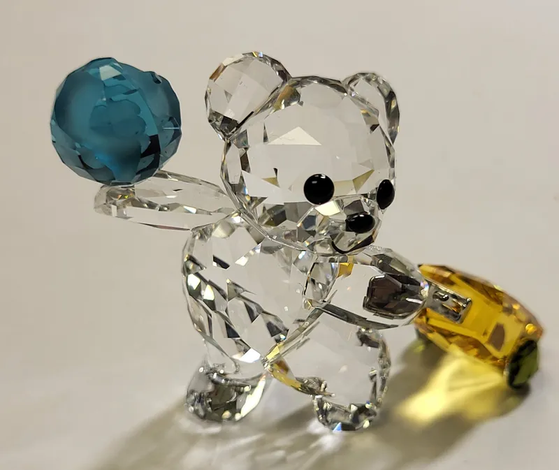 swarovski kris bear travel the world figurine from auction in wilmington , North Carolina