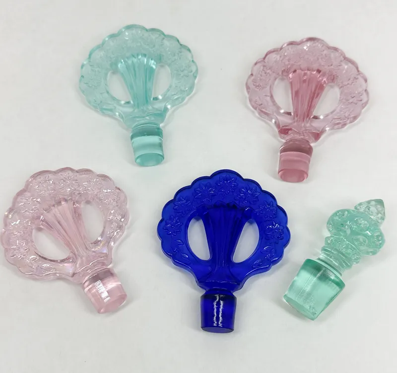 GLASS PERFUME STOPPERS, MID-20TH CENTURY from auction in BETHESDA, Ohio