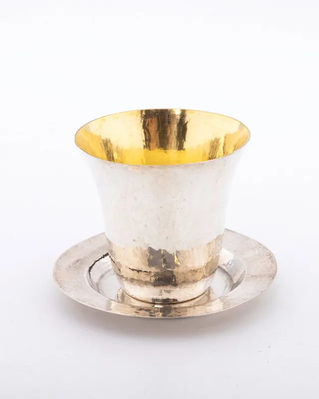 A STERLING SILVER KIDDUSH CUP AND UNDERPLATE BY DOVID COHEN. Israel, modern. from auction in woodmere, New York