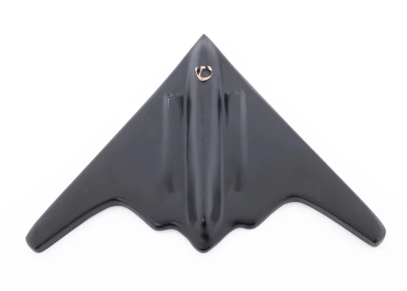 A HEAVY COPPER MEZUZAH IN THE SHAPE OF A B-2 BOMBER. Israel, modern from auction in woodmere, New York