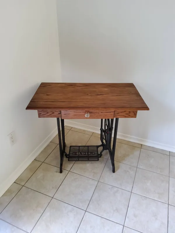Singer Sewing Machine Table with Cast Iron Base from auction in Covington, Louisiana