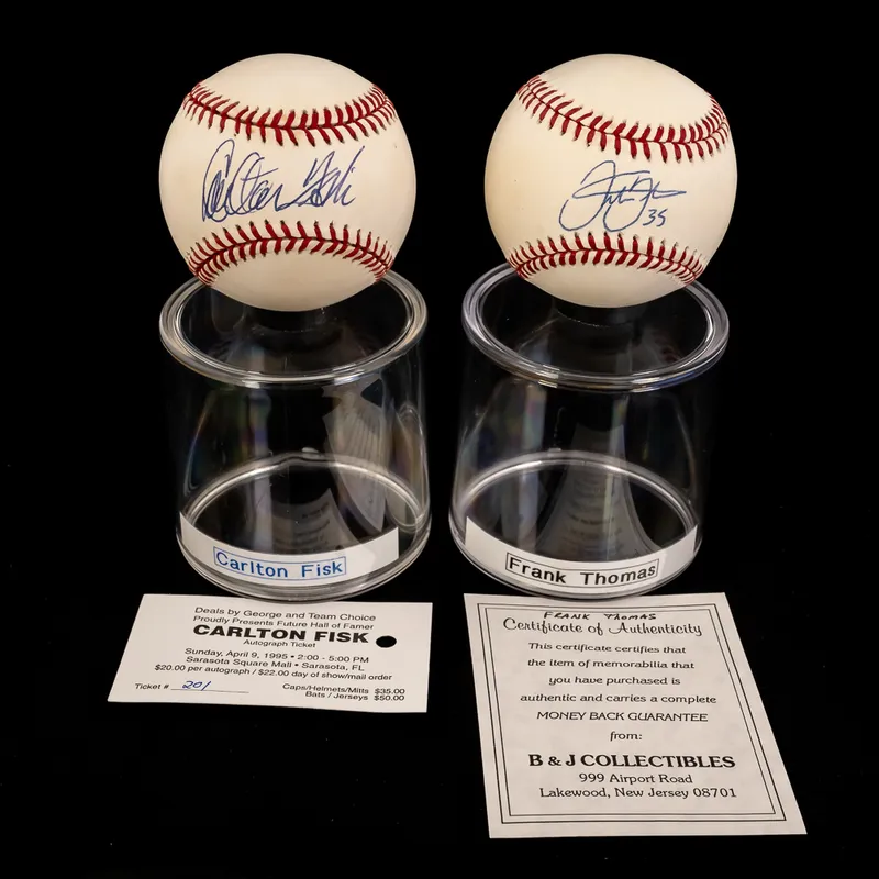 Carlton Fisk & Frank Thomas Autographed Baseballs from auction in Union, Illinois