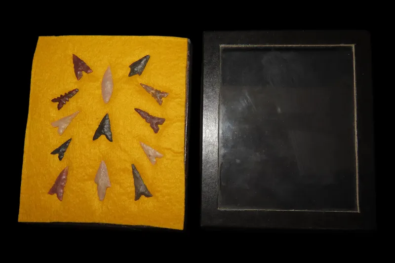 5" x 6" Riker Frame with 13 Neolithic Arrowheads, Seira Desert, Northern Africa, Reported 5,000 Years Old from auction in Quincy, Illinois