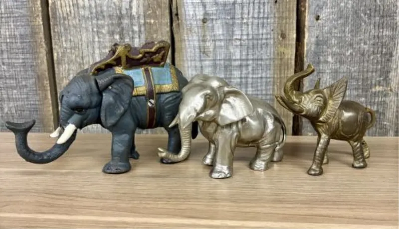 A Trio of Vintage - Vintage Style Metal Elephant Figurines Including a Cast Iron Coin Bank from auction in Shelbyville, Kentucky
