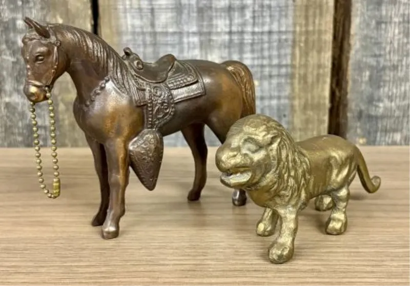 Two Vintage Brass - Cast Metal Animal Figurines, Saddled Horse and Lion from auction in Shelbyville, Kentucky