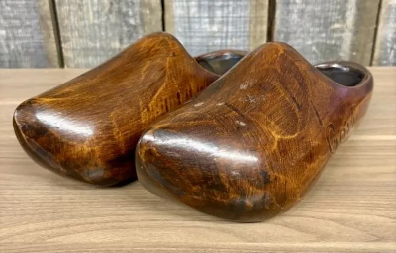 A Pair of Vintage Hand-Carved and Stained Wooden Clogs from auction in Shelbyville, Kentucky