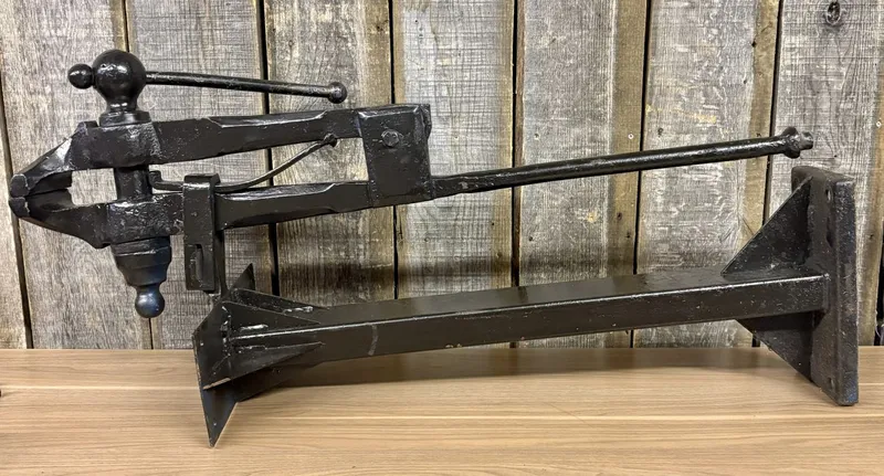 Vintage Forged Iron Blacksmith Leg Vise Mounted on Steel Stand from auction in Shelbyville, Kentucky