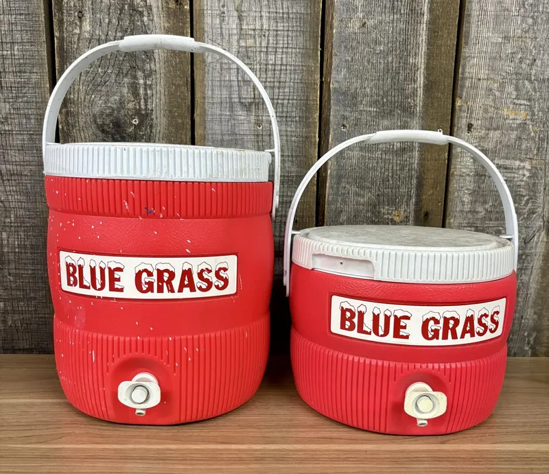 A Pair of Vintage Blue Grass Insulated Beverage Dispensers from auction in Shelbyville, Kentucky