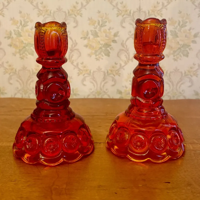 A Pair of Amberina Glass Moon and Star Candlesticks from auction in Shelbyville, Kentucky