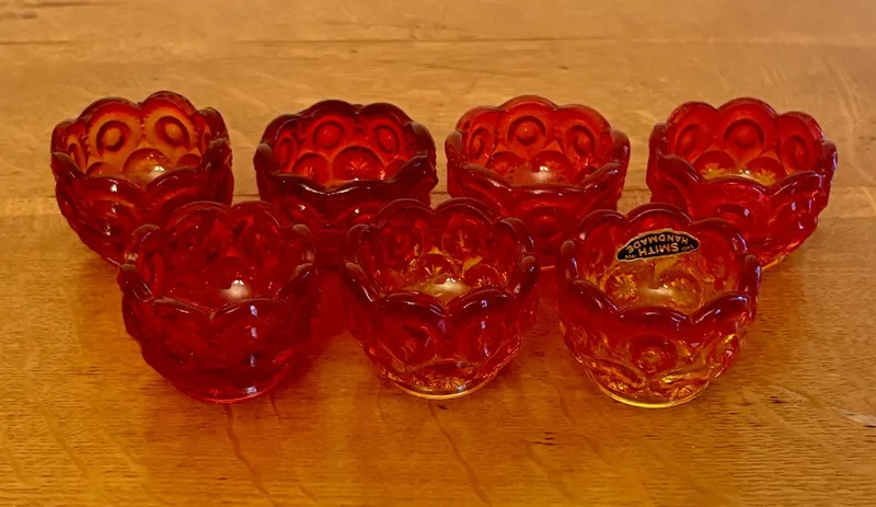 A Set of Seven L.E. Smith Amberina Glass Moon and Star Salt Cellars from auction in Shelbyville, Kentucky